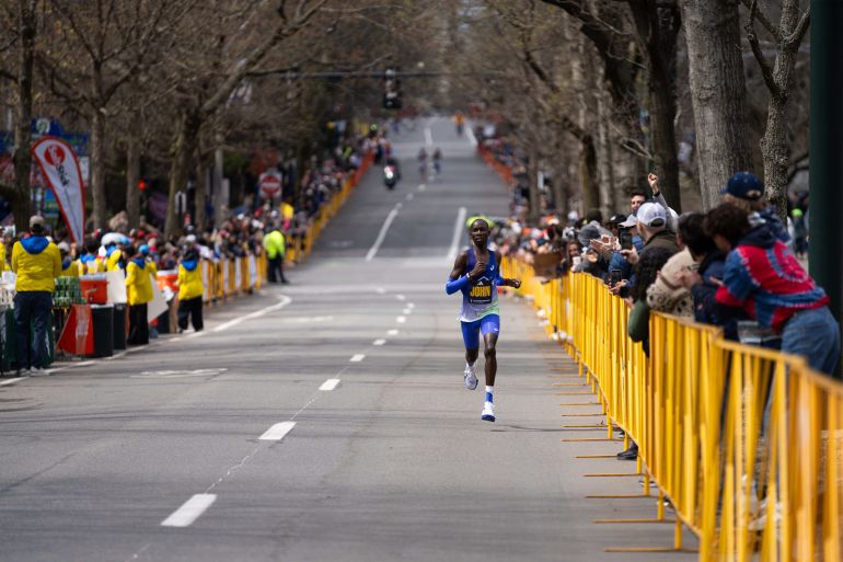 Kenya sweeps Boston Marathon with new world record and title defense