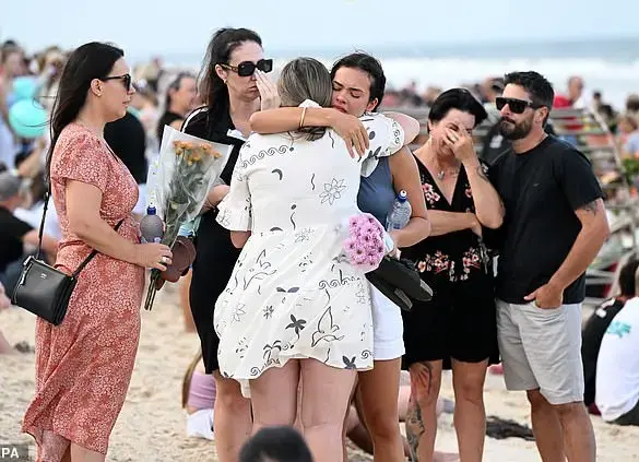 Shark attack victim's father pleads for people to continue visiting beaches