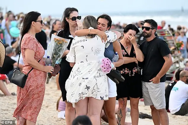 Shark attack victim's father pleads for people to continue visiting beaches