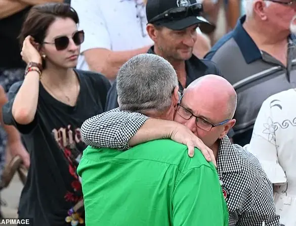 Shark attack victim's father pleads for people to continue visiting beaches