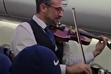 United Airlines Crew Member's Violin Serenade: A Surprising Interruption or Welcoming Surprise?